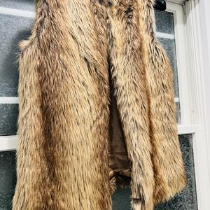 Faux Fur vest worn once. Beautiful w black jeans or leggings